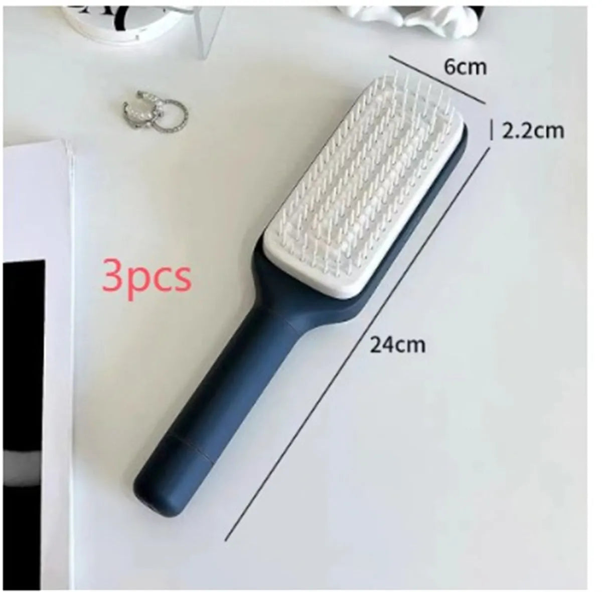 Roland Purple self-cleaning hair brush with rotating telescopic handle and anti-static bristles.