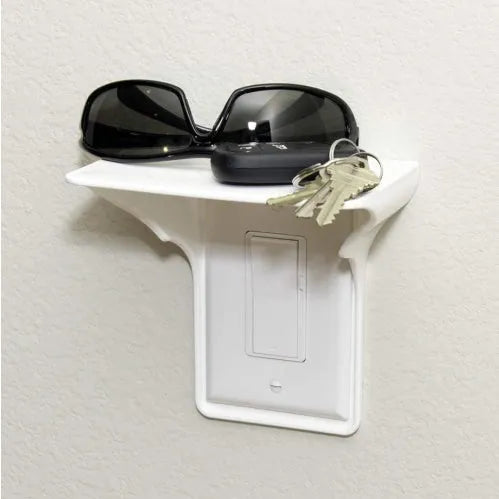 White plastic socket organiser rack with 18 angled slots on a workbench, holding various chrome sockets.