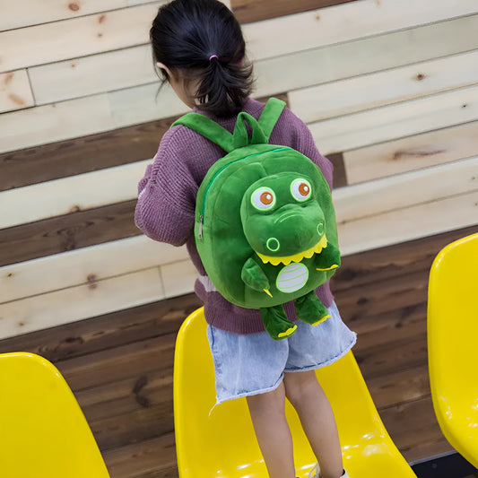 Soft blue dinosaur plush backpack with embroidery detail and a soft handle.