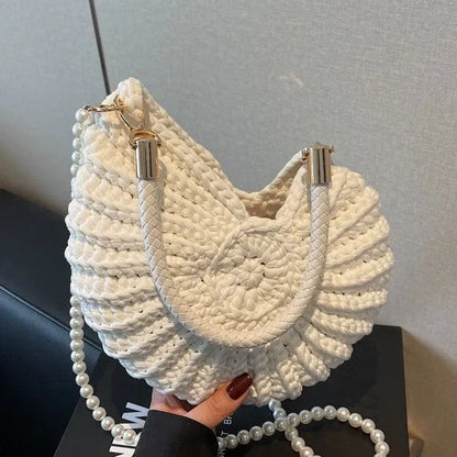 Handmade woven cloth bag with double shoulder straps in shell shape showing open pocket design