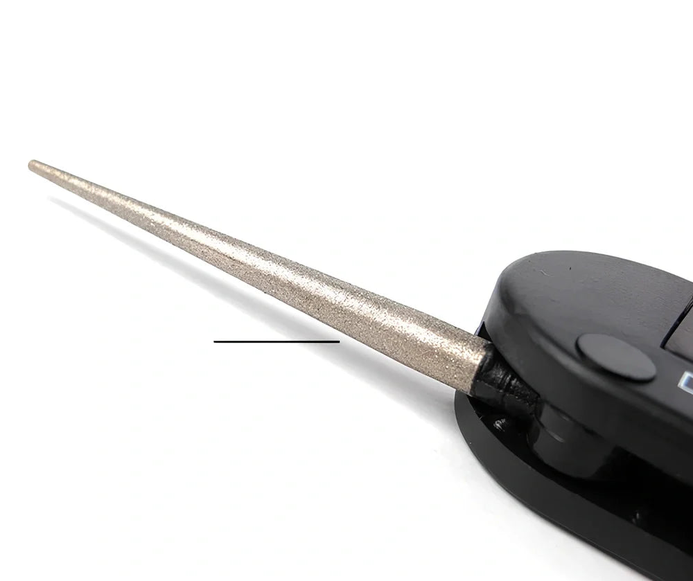 Black Pocket Pal knife sharpener showing carbide blades, ceramic stones, and tapered diamond rod on 3.5-inch compact unit