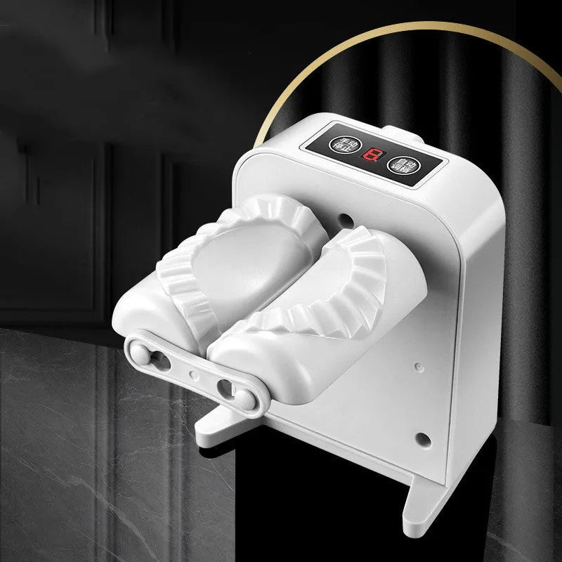 White automatic electric dumpling maker machine with USB cable, brush, and spoon.