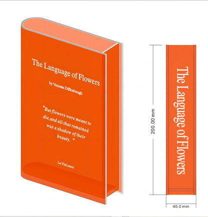 Transparent book-shaped acrylic vase, 22cm long with black font, refracting sunlight for home decor