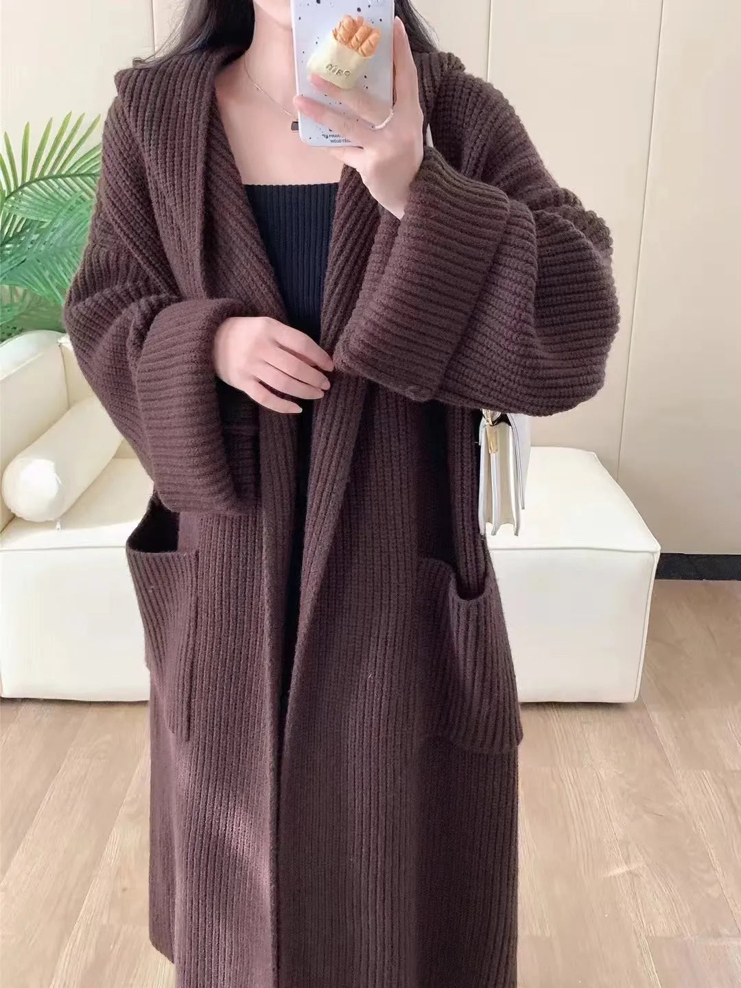 Loose hooded women's cardigan with raglan sleeves in milky white colour showing extended 80cm length