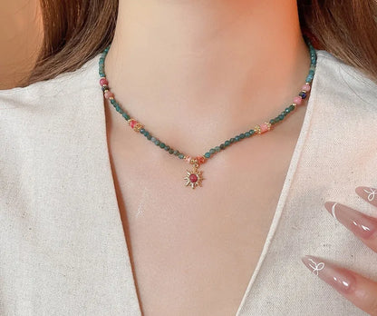 French court style freshwater pearl necklace with stone sun pendant on clavicle chain