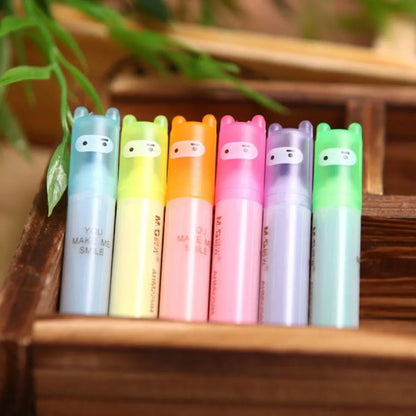 Set of six slanted plastic highlighter pens showing six different fluorescent ink colours.