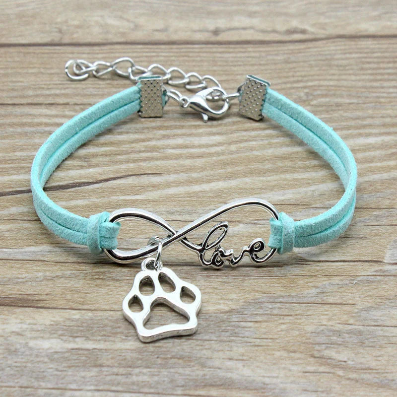Hand-woven Infinite Love Pet Bracelet in various colors, showcasing the bow shape and alloy material.
