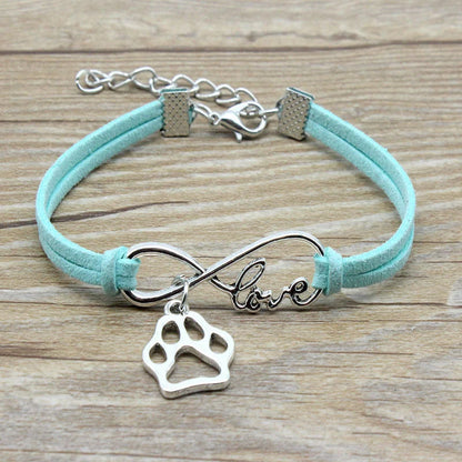 Hand-woven Infinite Love Pet Bracelet in various colors, showcasing the bow shape and alloy material.