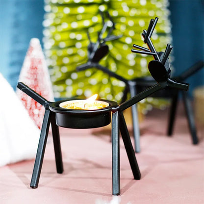 Black iron Christmas candlestick holder with elk bracket design and Santa Claus motifs