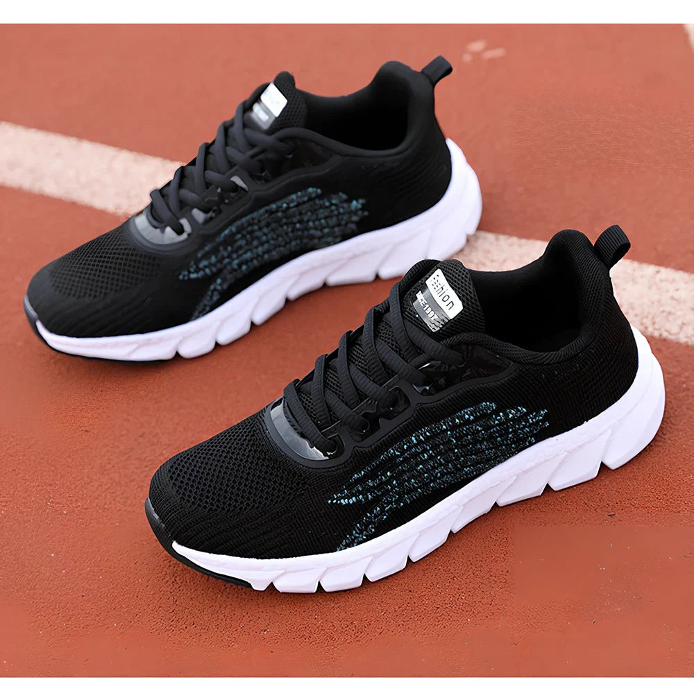 Women's black running sneakers with MD soles and cross strap detailing for jogging