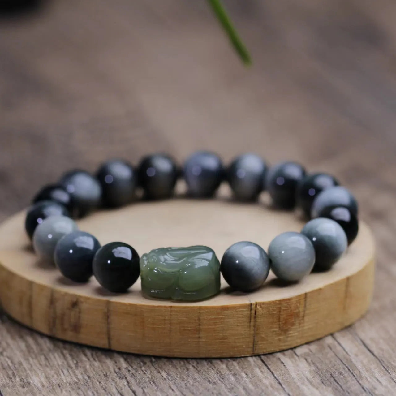 Black bracelet with 10mm Eagle Eye Stone beads and genuine Hetian jade Pixiu pendant