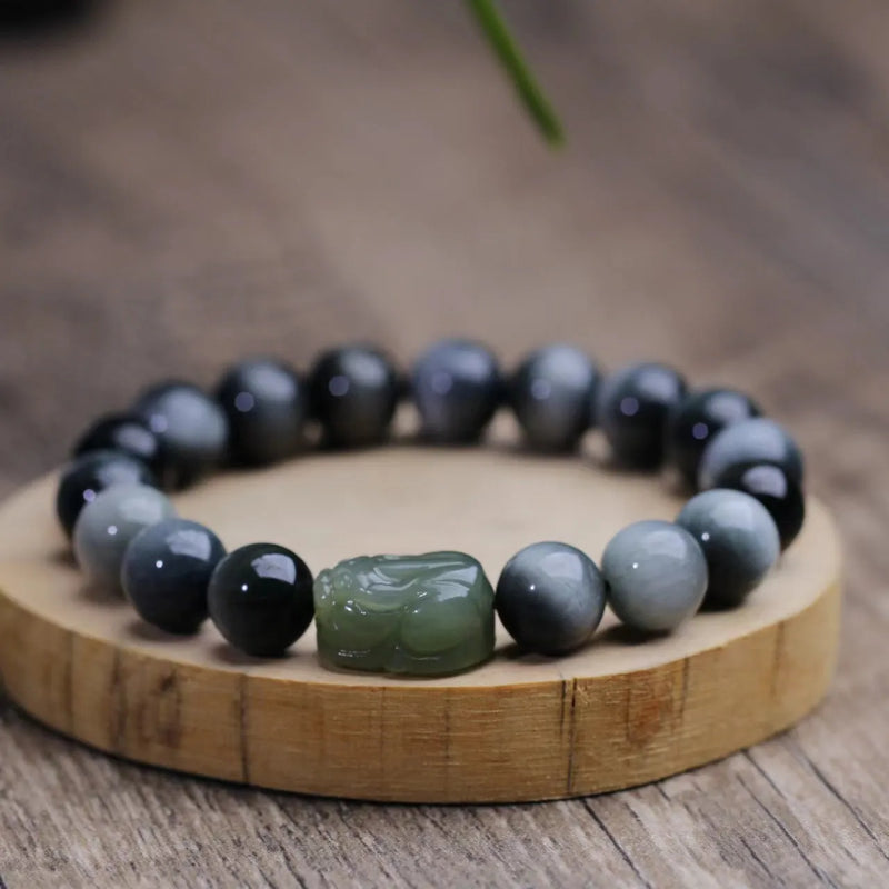 Natural Hetian Jade Pixiu Bracelet with 10mm Eagle Eye Stone beads, genuine jade pendant and black cord design, unisex adjustable bracelet for spiritual protection and wealth attraction during anniversary celebrations and gift occasions