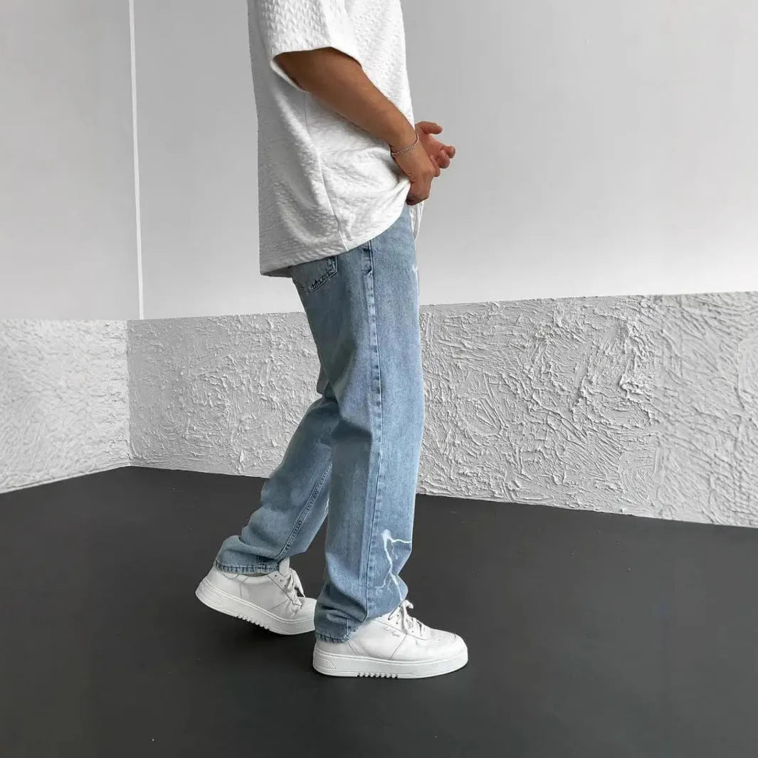 Men's blue straight-leg denim trousers with mid-waist design and zipper fly closure