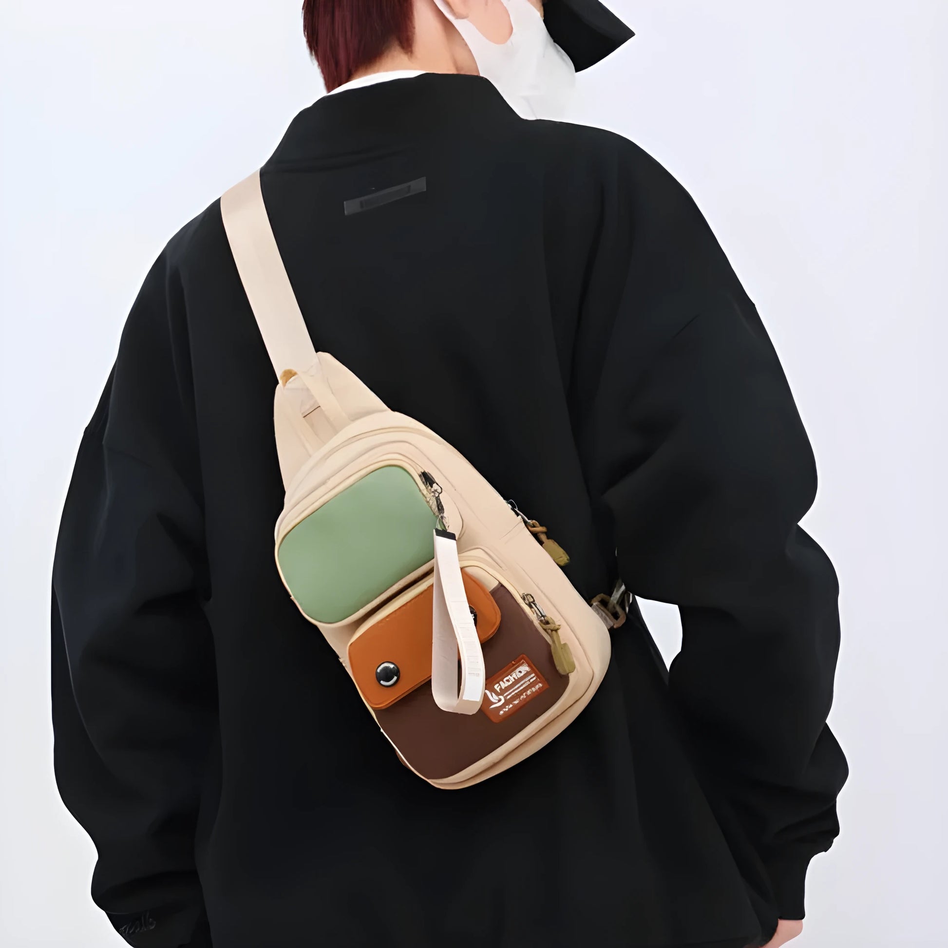 Nylon crossbody shoulder bag with letter pattern in beige contrast colour.