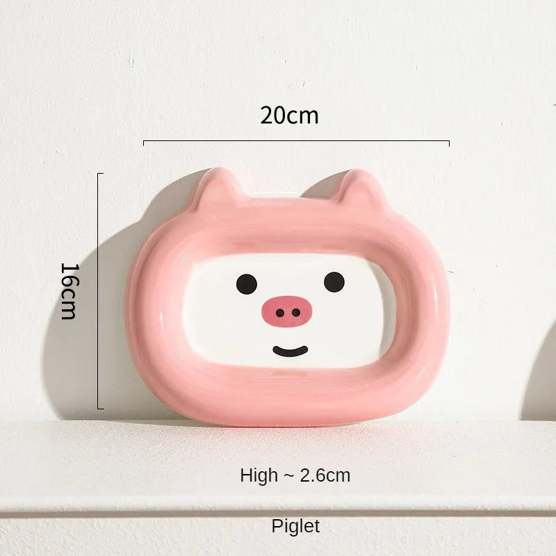 Handcrafted ceramic pet bowl with an animal design, for cat or dog food and water.