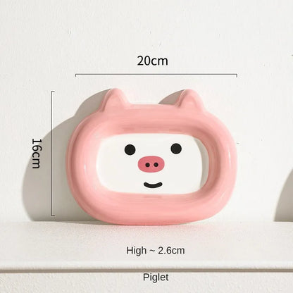 Handcrafted ceramic pet bowl with an animal design, for cat or dog food and water.