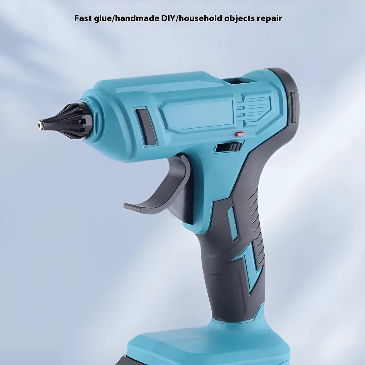 Cordless hot melt glue gun with bare metal body, two lithium batteries, charger, and pack of 11mm glue sticks.