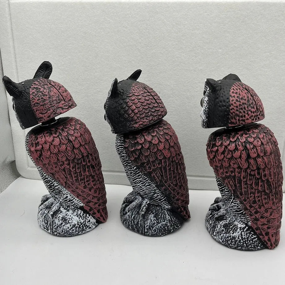 Set of artificial owl bait ornaments with shaking heads for scaring birds outdoors.