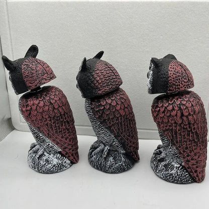 Set of artificial owl bait ornaments with shaking heads for scaring birds outdoors.