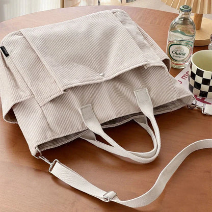 Adjustable corduroy messenger bag in various colors with zippered pocket