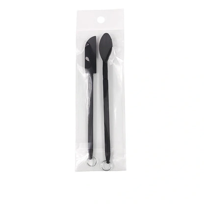 Retractable silicone cosmetic spatula extended to 15cm with scraper tool for product application