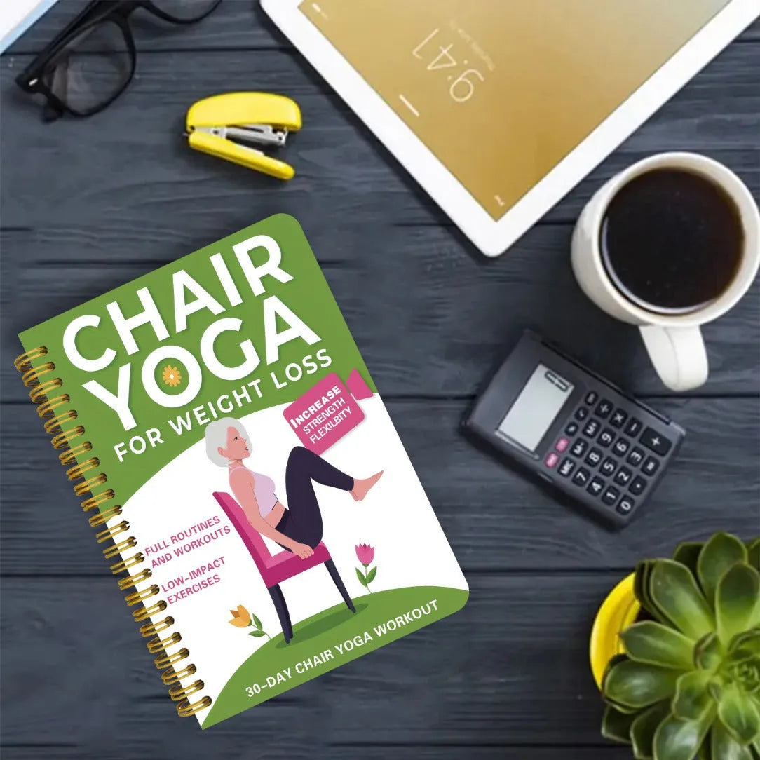 Green coil-bound 30 day chair yoga training notebook open to daily plan pages