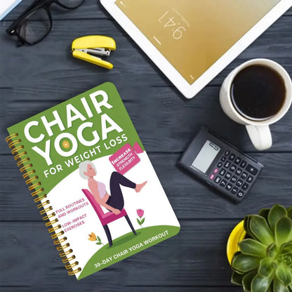 Green coil-bound 30 day chair yoga training notebook open to daily plan pages