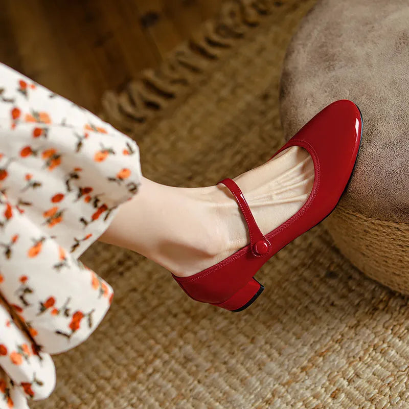 Women's chunky heel retro round head pumps with ankle-strap buckle, two-layer cowhide upper, rubber sole, red or black, sizes 35-39