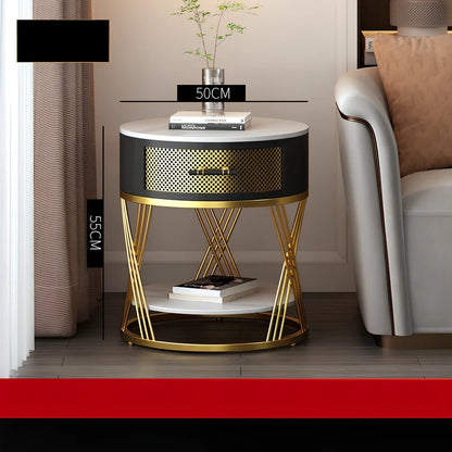 Round coffee table with slate surface and metal frame, featuring integrated storage compartment