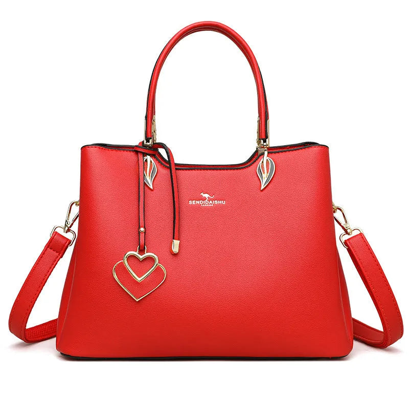 Women's black PU leather messenger bag with multi-layer shoulder strap and sewing thread detailing.
