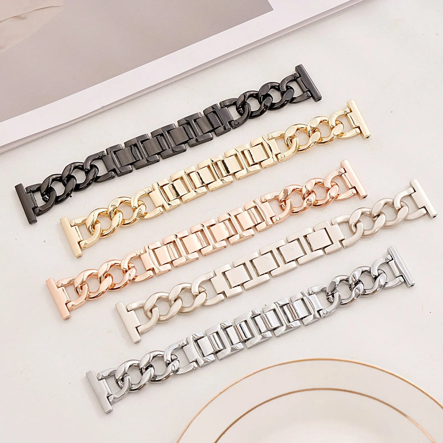 Silver metal link watch strap for Apple Watch with 22mm connectors on a grey background