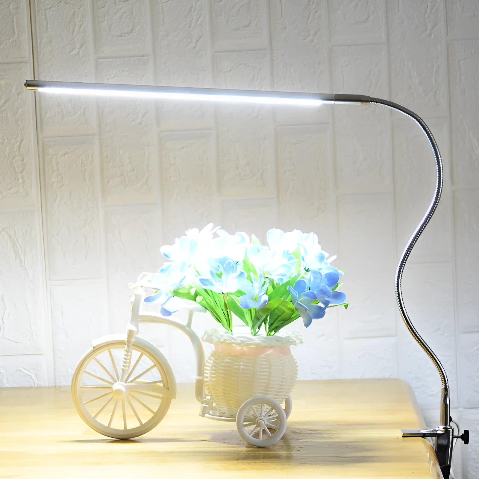 Silver aluminium alloy LED nail lighting table lamp with long arm and clip mounting for beauty workstations