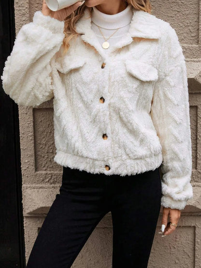 Ivory white women's double-sided plush button-front cardigan coat on a hanger.