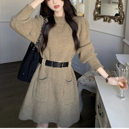 Women's long sleeve loose knitted dress in beige with black belt, showing high waist design and free size fit