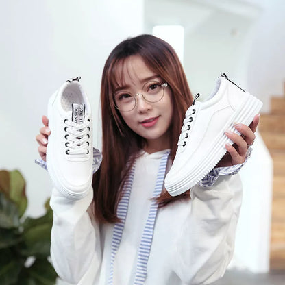 Breathable women's sneakers in black, green, and pink with rubber outsole