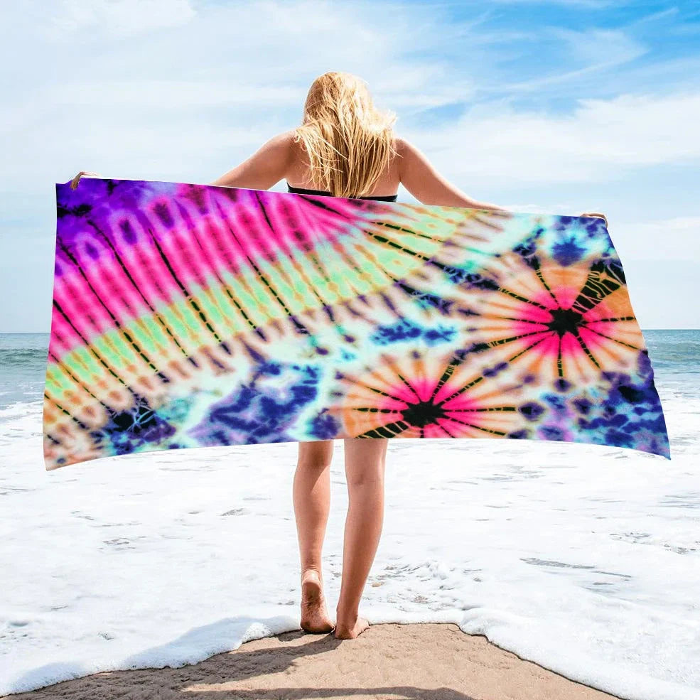 Square beach towel with tie-dye pattern showing superfine fibre texture and vibrant colours