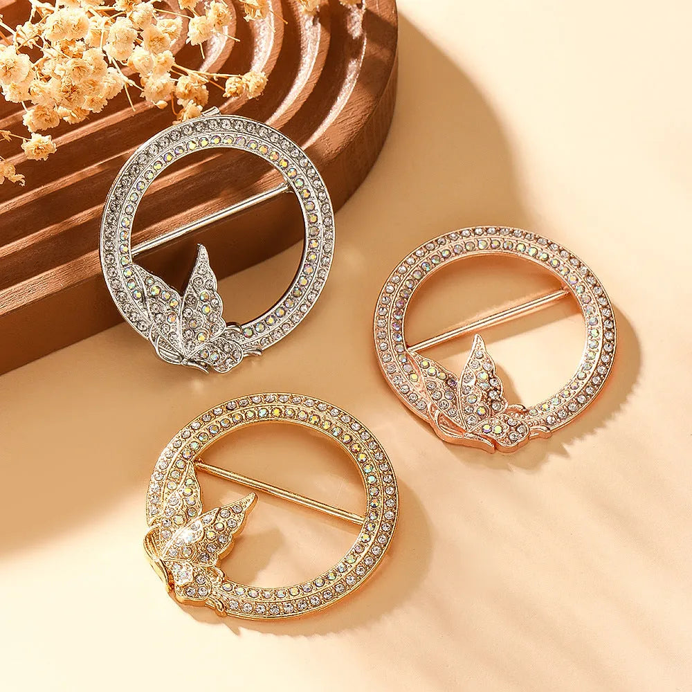 Bow-shaped waist-cinching accessory clip for high-end brooches, alloy with electroplating and diamond inlay, shown in gold, silver, or rose gold finishes.