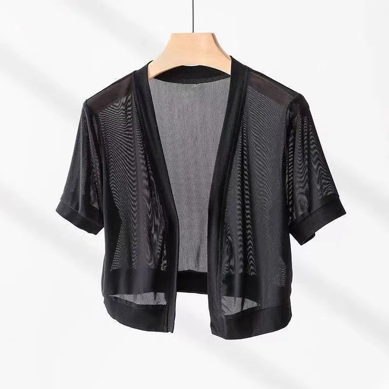 Women's French-style irregular collar long sleeve tied shirt in black with bell sleeves and tied front