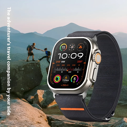 Elastic nylon Apple Watch band in Army Green with stainless steel buckle, shown on a wrist.
