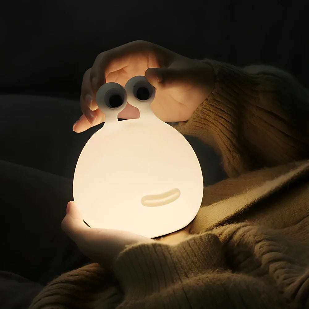 White cartoon slug night light with touch activation and USB power connection