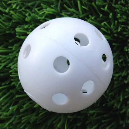 Hollow plastic golf practice balls in various colors for indoor use