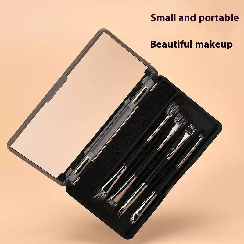 Makeup brush set with mirror compact case showing silver or gold brushes with artificial fibre bristles