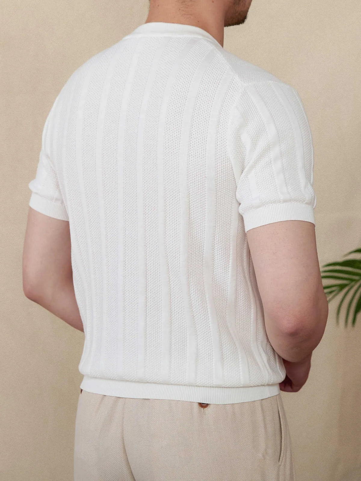 Men's beige cotton short-sleeve T-shirt with a Henry collar and a subtle sunken stripe knitted pattern.