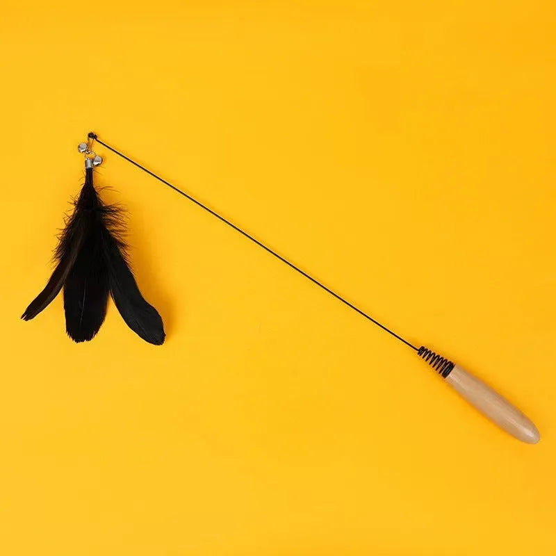 Wooden handle cat teasing stick with spring and replaceable feather bell head toy