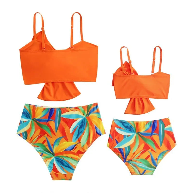 Women's big bow print bikini and swim trunks set in nylon fabric showing colour options