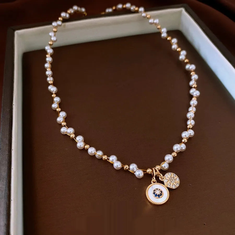 Gold-white necklace with round geometric pendant featuring zircon and imitation pearl on adjustable 41-50cm chain