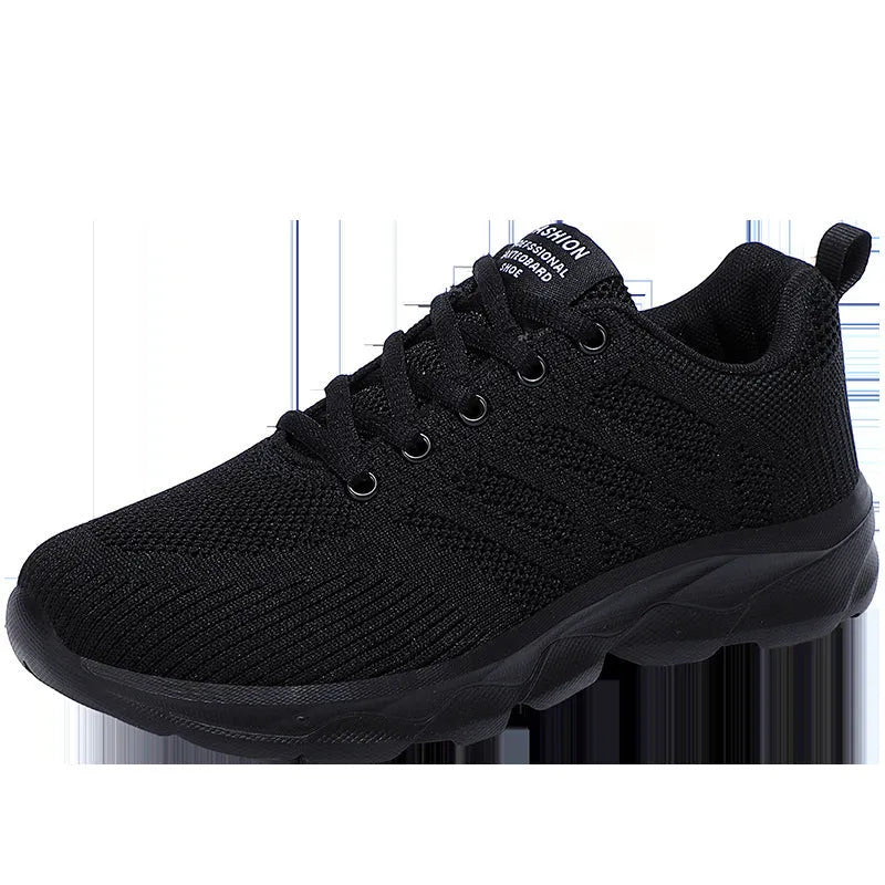 Women's white mesh fabric lace-up leisure shoes with a low heel on a plain background.