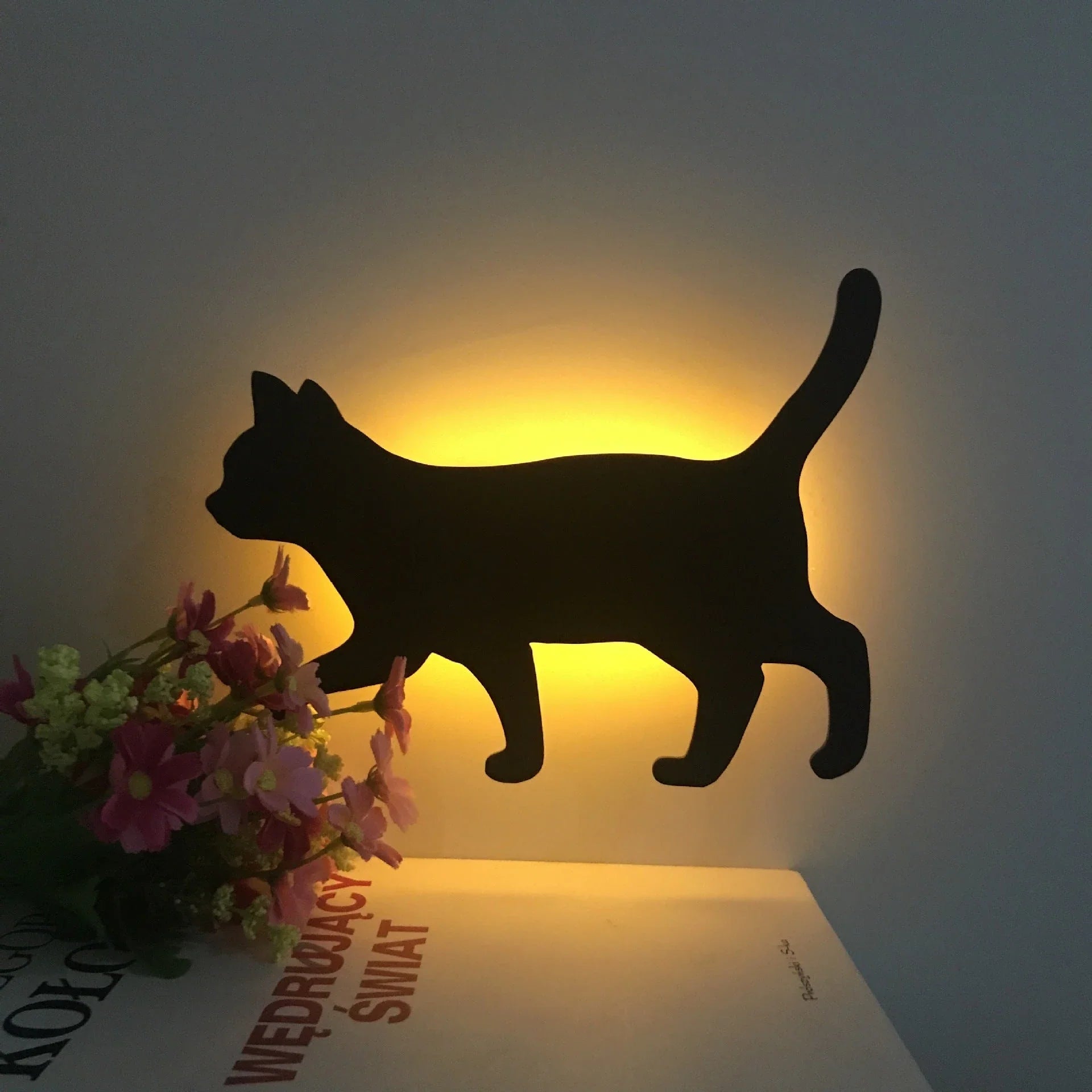 Illuminating pet-themed night light with smart sound sensor and customizable design