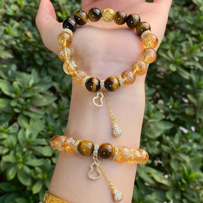 Handmade crystal bracelet with diamond gourd, disc, and prayer wheel beads in 8mm and 10mm sizes.