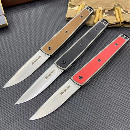 Folding fruit knife with 7cm stainless steel blade shown open and closed, available in black, red, or coffee colour finishes